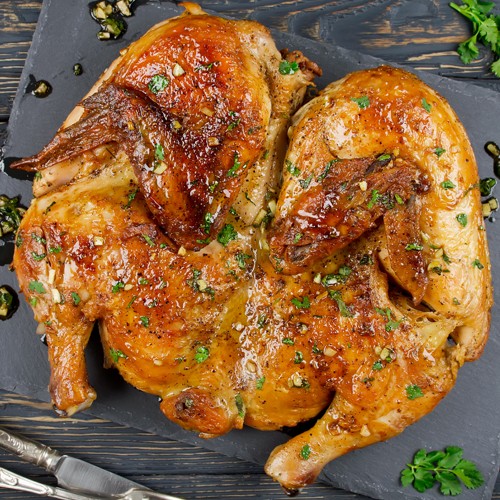 Chicken tabaka with coriander and lemon Chicken tabaka with coriander and lemon